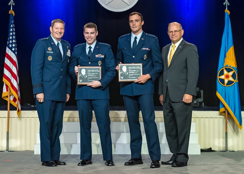 Gen. Robin Rand, Global Strike Command commander, left, and retired Brig. Gen. Scott Van Cleef, Air Force Association alumni, right, present the General Thomas S. Power Award to Capt. Ian Sylvester and 1st Lt. Michael McCrary, both of 341st Operations Group, at the Air, Space and Cyber Conference National Aerospace Awards, hosted by the Air Force Association on Washington D.C., Sept. 19, 2016.  This award is presented to the best missile team in the Air Force.  