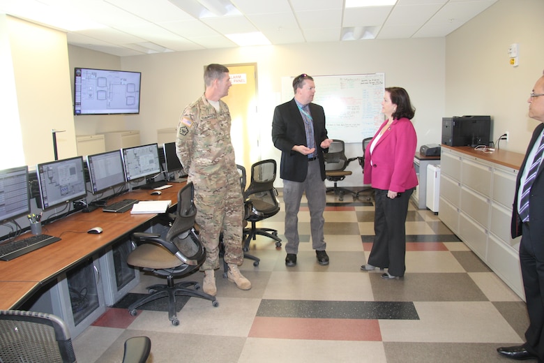 Christopher Woodruff, water resources manager, Fort Irwin Department of Public works (center), briefs Assistant Secretary of the Army for Installations, Energy, and Environment Katherine Hammack (right), and South Pacific Division Commander Col. Pete Helmlinger (left) on the Irwin Water Works water treatment process during a tour of the IWW facility at Fort Irwin, California Oct. 13.

Hammack joined Helmlinger, Los Angeles District Commander Col. Kirk Gibbs and Fort Irwin and the National Training Center senior leaders in a ribbon cutting ceremony celebrating the completion and operation of the new Fort Irwin water treatment plant, also known as the Irwin Water Works. 