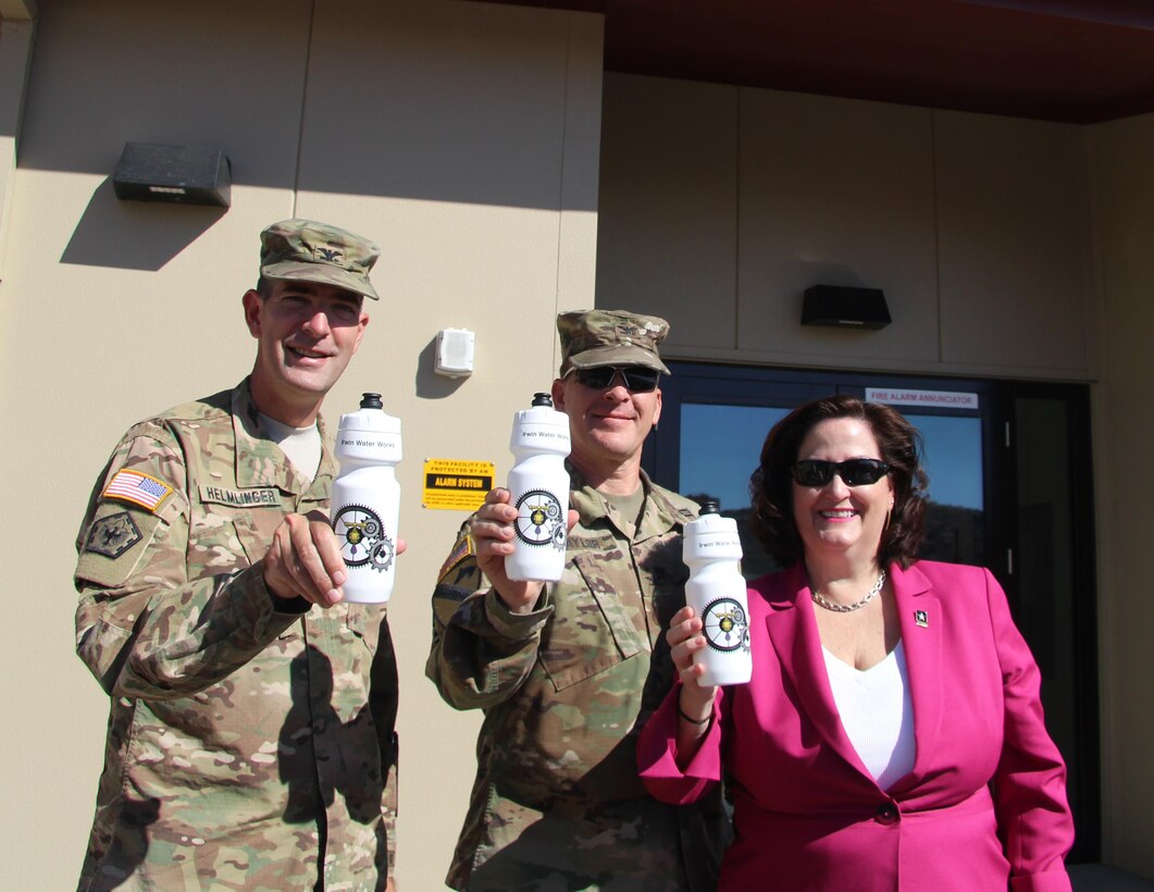 Assistant Secretary of the Army for Installations, Energy and Environment Katherine Hammack (right) joined U.S. Army Corps of Engineers South Pacific Division Commander Col. Pete Helmlinger(Left),and Fort Irwin and the National Training Center Garrison Commander Col. Scott Taylor (center) in celebratory drink of water that was produced from the Irwin Water Works after a ribbon cutting ceremony celebrating the completion and operation of the IWW. The ceremony was held in front of the IWW Control Building at Fort Irwin, California Oct. 13.