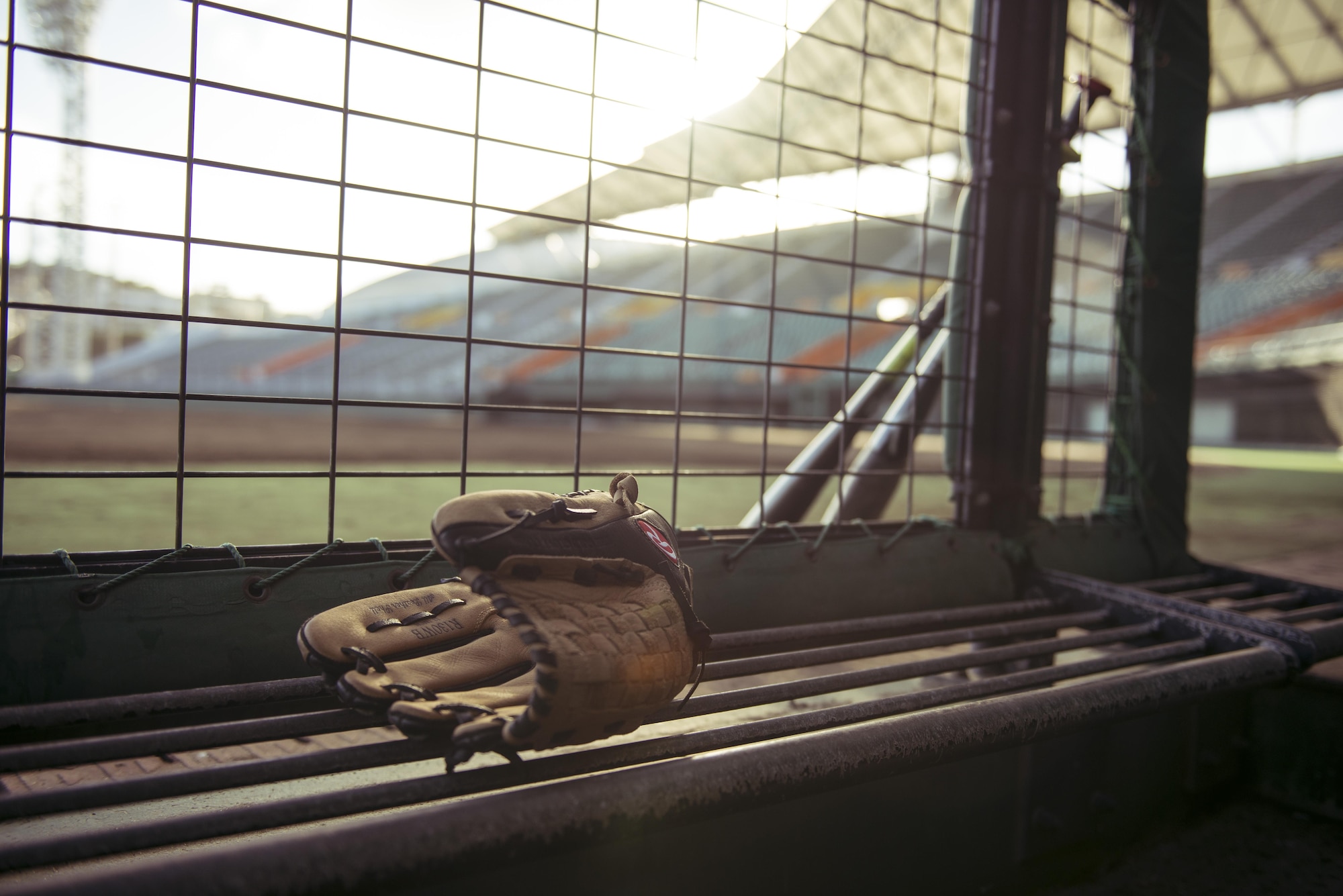 Bats and a glove rest at the entrance of a dugout after baseball games between the Japan Air Self-Defense Force Southwestern Composite Air Division and the Allstars Oct. 15, 2016, at the Cellular Stadium in Naha, Japan. The Allstars, a team created by the U.S. consul general of Naha, plan to play multiple games against other teams on Okinawa building partnerships and spreading diplomacy through the common U.S.-Japan interest of baseball. (U.S. Air Force photo by Senior Airman Omari Bernard)