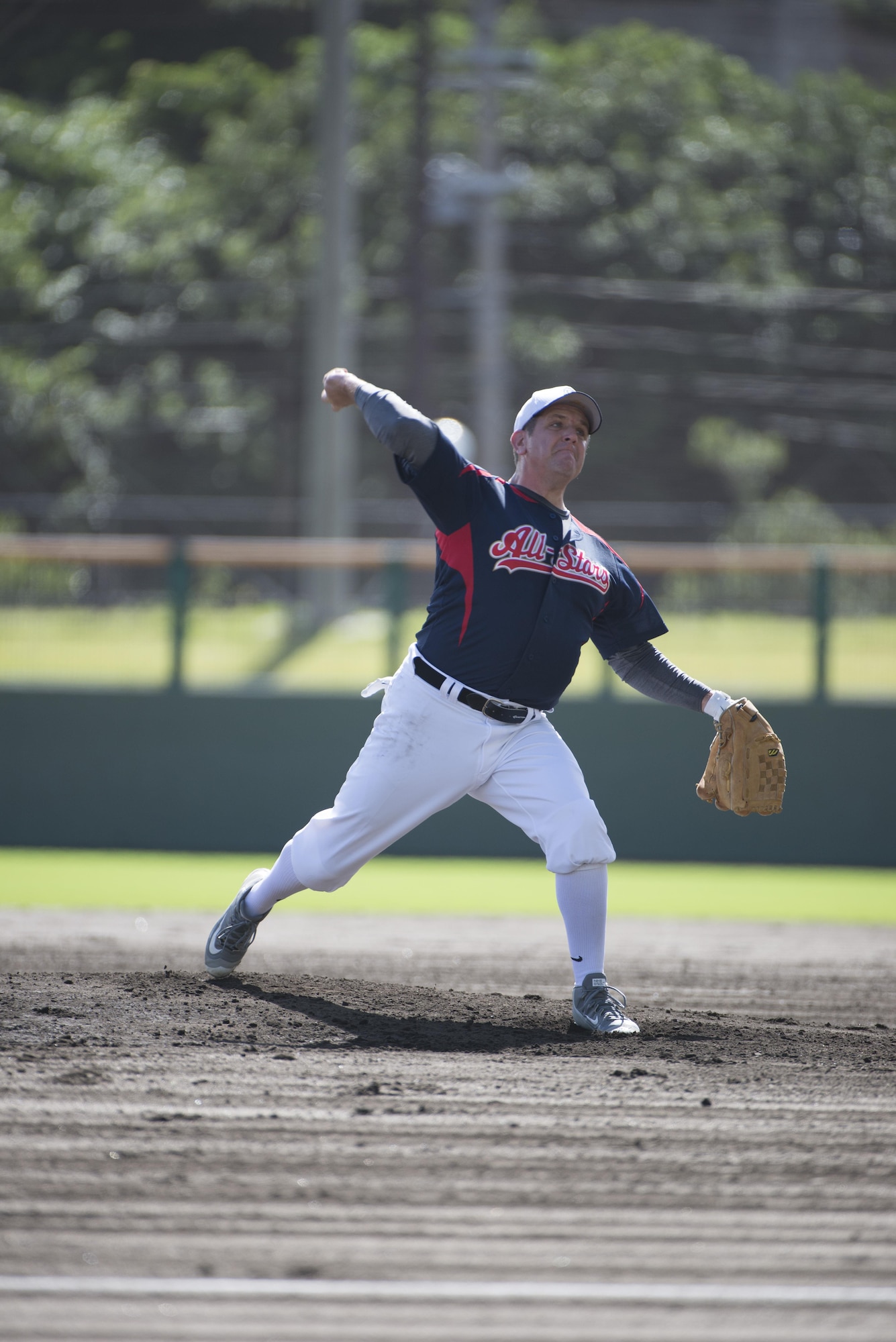 U.S. Air Force Col. Christopher Amrhein, 18th Wing vice commander, throws a pitch during a baseball game against the Japan Air Self-Defense Force Southwestern Composite Air Division Oct. 15, 2016, at the Cellular Stadium in Naha, Japan. The Allstars played the JASDF to build trust and partnership through a popular sport shared by the U.S. and Japan. (U.S. Air Force photo by Senior Airman Omari Bernard)