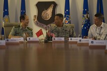 People's Liberation Army Senior Col. Hua Bo and U.S. Air Force Col. Art Primas, Pacific Air Forces International Affairs division chief, speak during a mid-level officer exchange at Joint Base Pearl Harbor-Hickam, Hawaii, Oct. 18, 2016. The PLA delegation visited PACAF as part of an annual exchange tour that included a stop at U.S. Pacific Command. (U.S. Air Force photo by Staff Sgt. Alexander Martinez)
