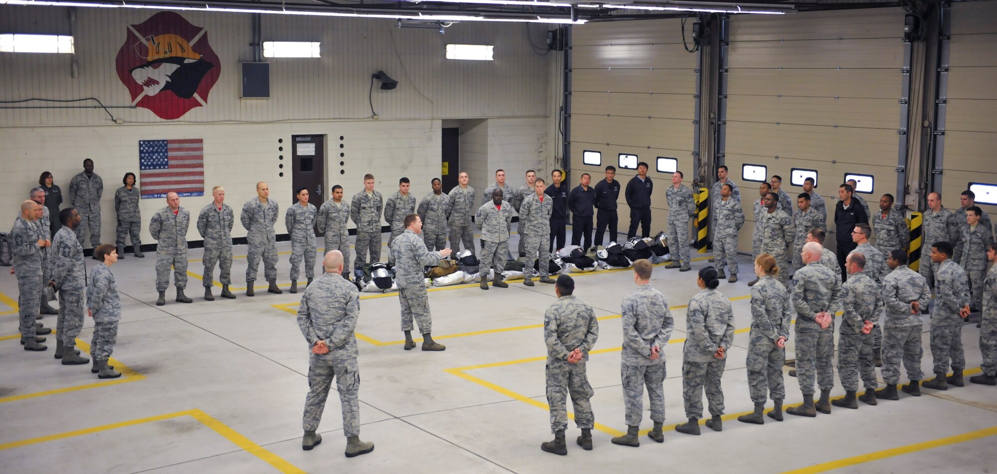 Col. Todd “Wolf” Dozier, 8th Fighter Wing commander, thanks the 8th Civil Engineer Squadron fire fighters for their role during a fire on Kunsan Air Base, Republic of Korea, Oct. 21, 2016. Through the efforts of Tech. Sgt. Darnell and his team, they saved a 2.6 million dollar building. (U.S. Air Force photo by Senior Airman Colville McFee/Released)  