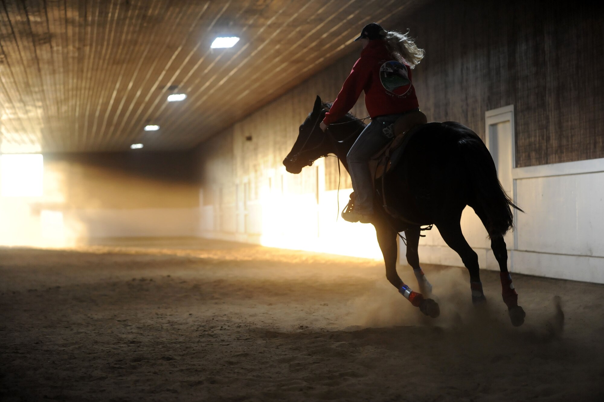 Airman 1st Class Lauren Nolan, 22nd Logistics Readiness Squadron materials management journeyman, practices her barrel racing patterns with her horse, Shoobie, Oct. 13, 2016, in Wichita, Kan. Shoobie is a 6 year old off-the-track thoroughbred. Nolan works with her to train for barrel racing competitions.  (U.S. Air Force photo/ Airman 1st Class Jenna K. Caldwell)
