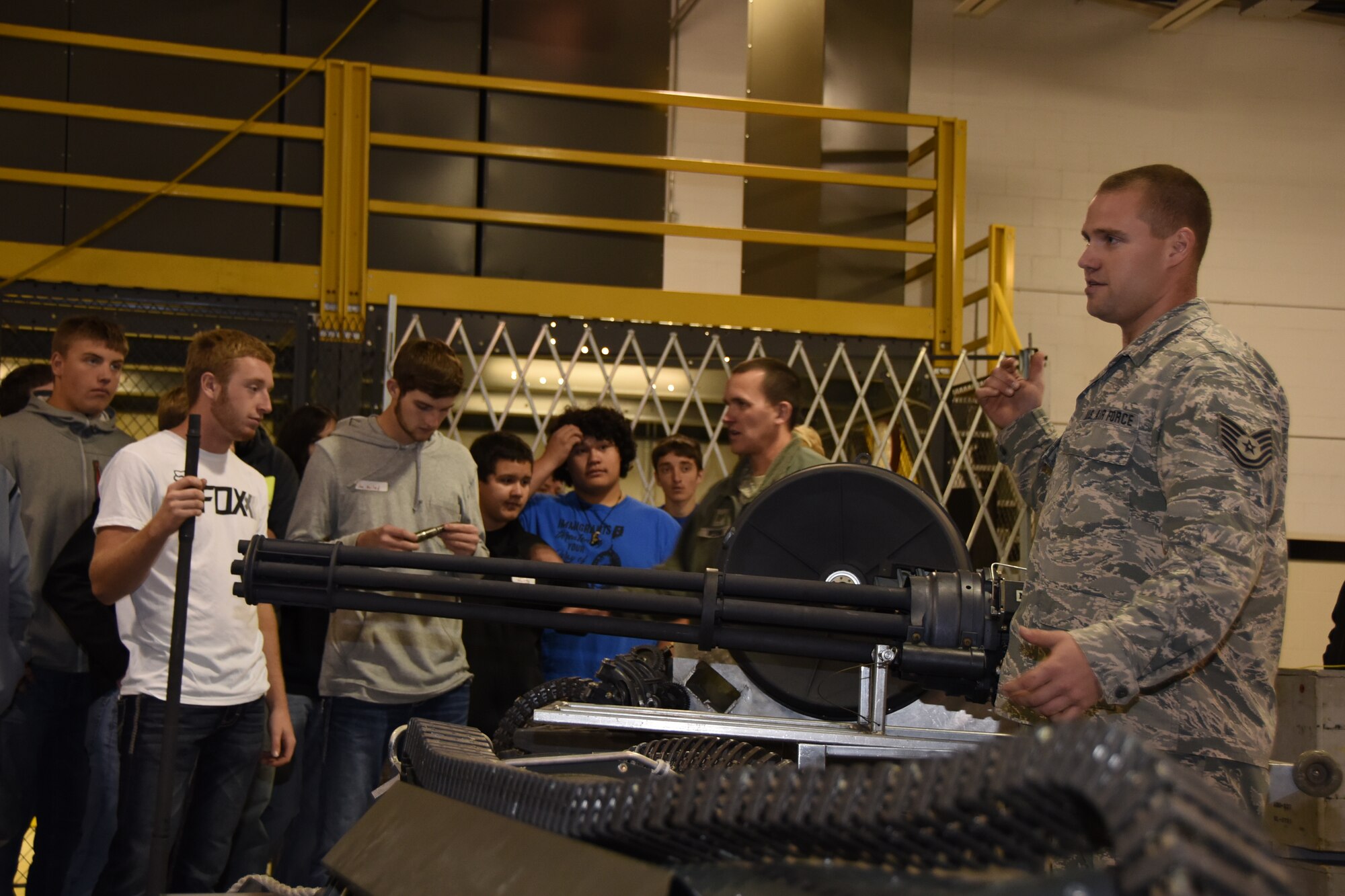 Tech. Sgt. Mike Larson and Tech. Sgt. Bret Werning, 114th Aircraft Maintenance weapons specialists, discuss what being a weapon specialists means to them to high school students during Career Day at Joe Foss Field, S.D. Oct. 19 ,2016. Career day showcases different vocations which the Airmen of the 114 FW perform on a daily basis. (U.S. Air National Guard photo by Staff Sgt. Duane Duimstra/Released) 