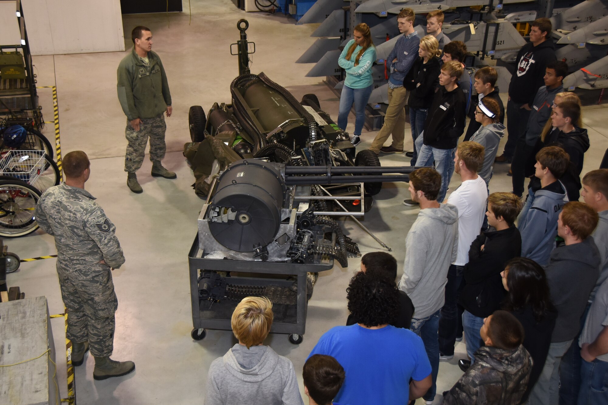 Tech. Sgt. Mike Larson and Tech. Sgt. Bret Werning, 114th Aircraft Maintenance weapons specialists, discuss what being a weapon specialists means to them to high school students during Career Day at Joe Foss Field, S.D. Oct. 19 ,2016. Career day showcases different vocations which the Airmen of the 114 FW perform on a daily basis. (U.S. Air National Guard photo by Staff Sgt. Duane Duimstra/Released) 