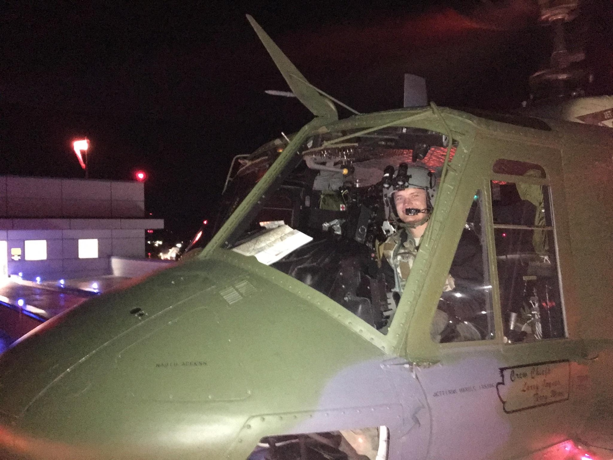 Capt. John Harris, co-pilot of the rescue mission, sits in a UH-1N Iroquois helicopter Oct. 10, 2016, at Kootenai Medical Center, Coeur d’Alene, Idaho. Harris and three other Airmen were part of a rescue mission to save an injured hunter from the side of a steep ravine. (Courtesy photo)