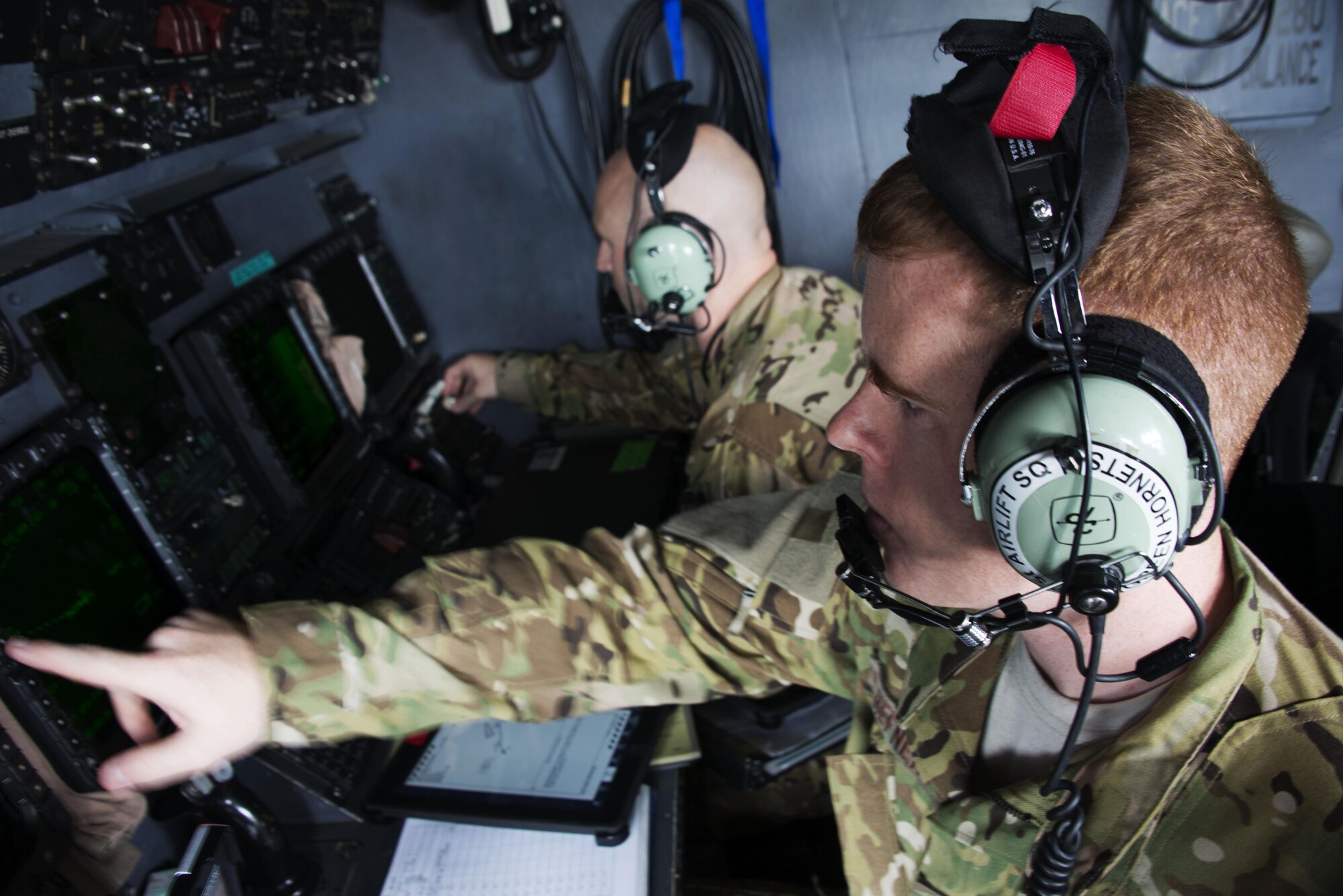 Capt. Jeremy Hefner, 1st Special Operations Squadron navigator performs pre-flight checks as the crew prepares for take-off at Kadena Air Base, Sept. 22. The crew transported equipment and personnel to Clark Air Base and Mactan-Benito Ebuen Air Base for Teak Piston 2016, a joint-combined exchange training (JCET) conducted with several units from the Philippine Air Force. (U.S. Air Force photo by Capt. Jessica Tait)