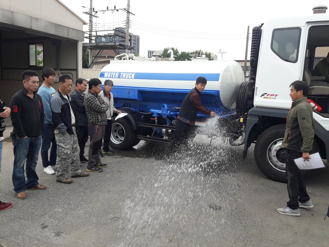 On Oct. 21 Choe, Min-kwan (right), Far East District logistic management office maintenance leader, provided training to district geotechnical branch employees on the capabilities, limitations, operation, and preventive maintenance checks and services of a new water truck that arrived at the district headquarters last week.