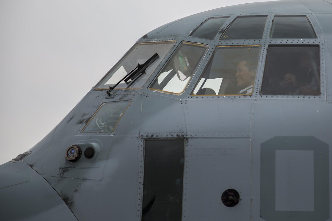 A Japan Air Self-Defense Force aviation cadet with the 12th Flight Training Wing from JASDF Hōfu-kita Air Base sits in the pilot seat of a KC-130J Hercules during a Japanese officer engagement program at Marine Corps Air Station Iwakuni, Japan, Oct. 19, 2016. Visiting the air station provided the cadets with the opportunity to interact with U.S. Marines and gain a greater knowledge and understanding of their present condition in Japan. The engagement program aims to enhance the understanding and working relationships between U.S. and Japanese pilots. (U.S. Marine Corps photo by Lance Cpl. Aaron Henson)
