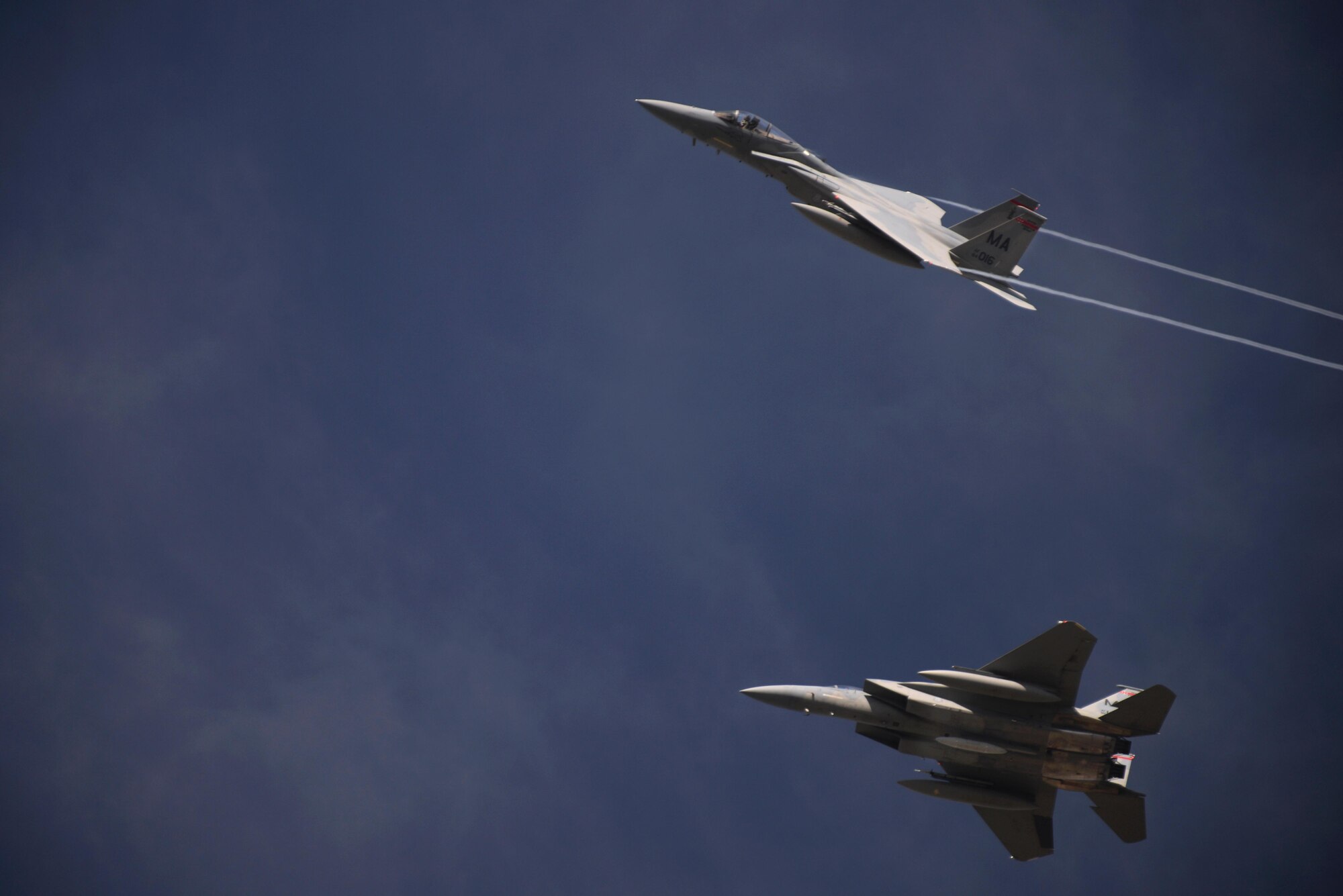 U.S. Air Force F-15C Eagles assigned to the California and Massachusetts Air National Guard peel away from formation at Royal Air Force Lakenheath, Engand, Sept. 28, 2016. The aircraft stopped at RAF Lakenheath on their way to their home station after participating in a joint NATO air policing mission. (U.S. Air Force photo/Airman 1st Class Eli Chevalier)