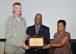 161019-D-ZS915-018: DLA Director Air Force Lt. Gen. Andy Busch and acting EEO Deputy Director Janice Samuel present Micah McCreary a certificate of appreciation for his help in highlighting National Disability Employment Awareness Month. 