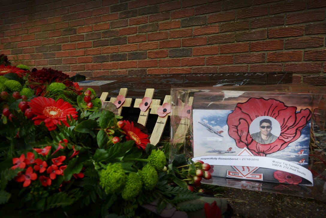 Doug McDonald, a Lakenheath community member and avid aviation enthusiast presented a wreath at memorial park to honor U.S. Marine Corps Maj. Taj Sareen, an F/A-18C pilot at Royal Air Force Lakenheath England Oct. 21, 2016. Sareen, a pilot with the Marine Attack Fighter Squadron 232, stationed at Marine Corps Air Station Miramar, Calif., was returning with his squadron after a six-month deployment in support of Operation Inherent Resolve when his jet crashed shortly after takeoff from Royal Air Force Lakenheath, England Oct. 21, 2015. (U.S. Air Force photo/ Airman 1st Class Abby Finkel)