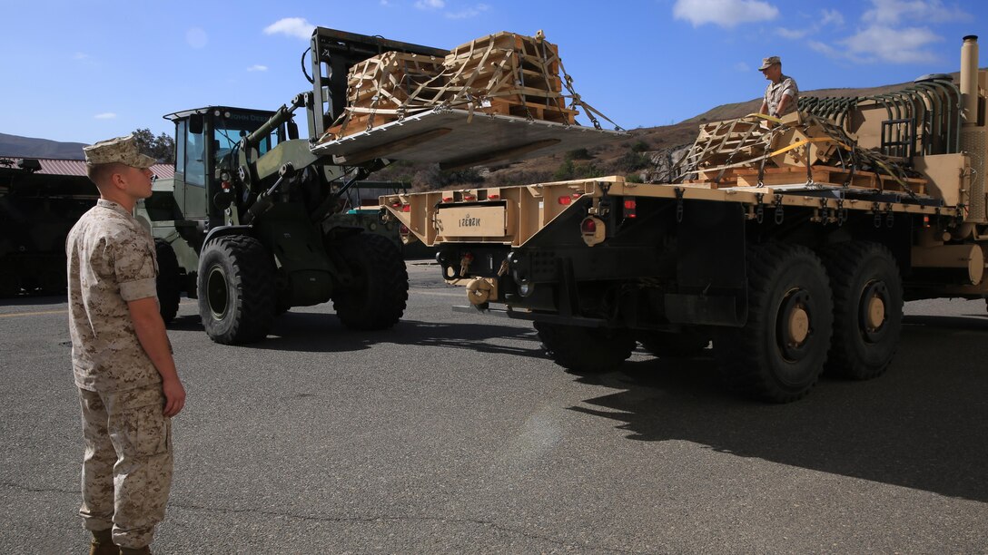 U.S. Marines from Combat Logistics Regiment 15 properly place pallets, filled with the M-88A2’s armored side skirts and front winch at Camp Pendleton, Calif., Oct. 3, 2016. The pieces were removed from the M-88A2 HERCULES to the reduce risk of parts coming loose and causing a safety hazard during the flight to Marine Corps Air Ground Combat Center Twentynine Palms, Calif.