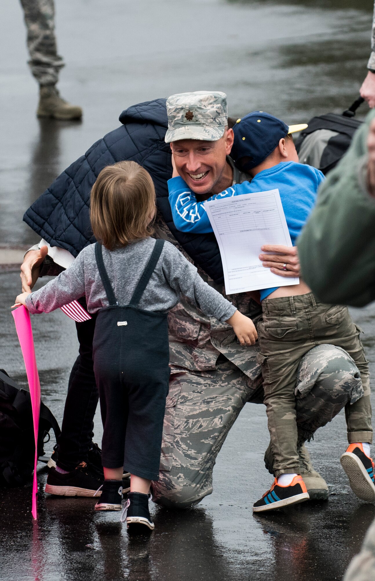 An Airman assigned to the 606th Air Control Squadron greets his children during the squadron’s return to Spangdahlem Air Base, Germany, Oct. 20, 2016. The squadron’s homecoming takes place in advance of their upcoming relocation from Spangdahlem to Aviano Air Base, Italy, in 2017 as part of the European Infrastructure Consolidation plan. (U.S. Air Force photo by Airman 1st Class Preston Cherry)