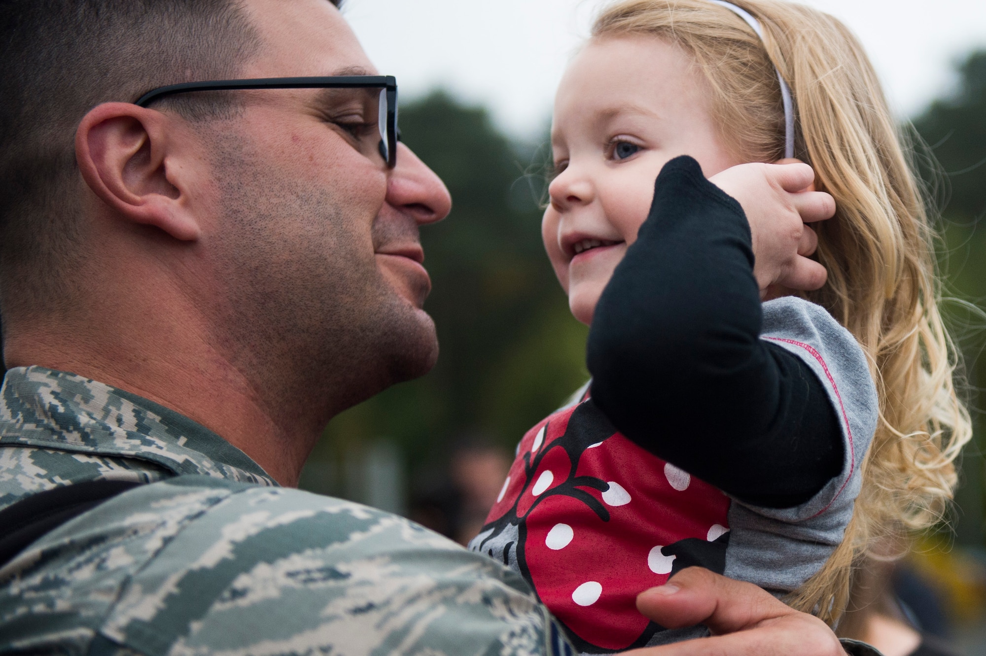 An Airman assigned to the 606th Air Control Squadron reunites with his daughter during the squadron’s return to Spangdahlem Air Base, Germany, Oct. 20, 2016. While deployed, the squadron provided support to the 727th Expeditionary Air Control Squadron, also known as Kingpin, which is composed of U.S. and coalition partners who monitor activity in the airspace surrounding their area of responsibility. (U.S. Air Force photo by Airman 1st Class Preston Cherry)