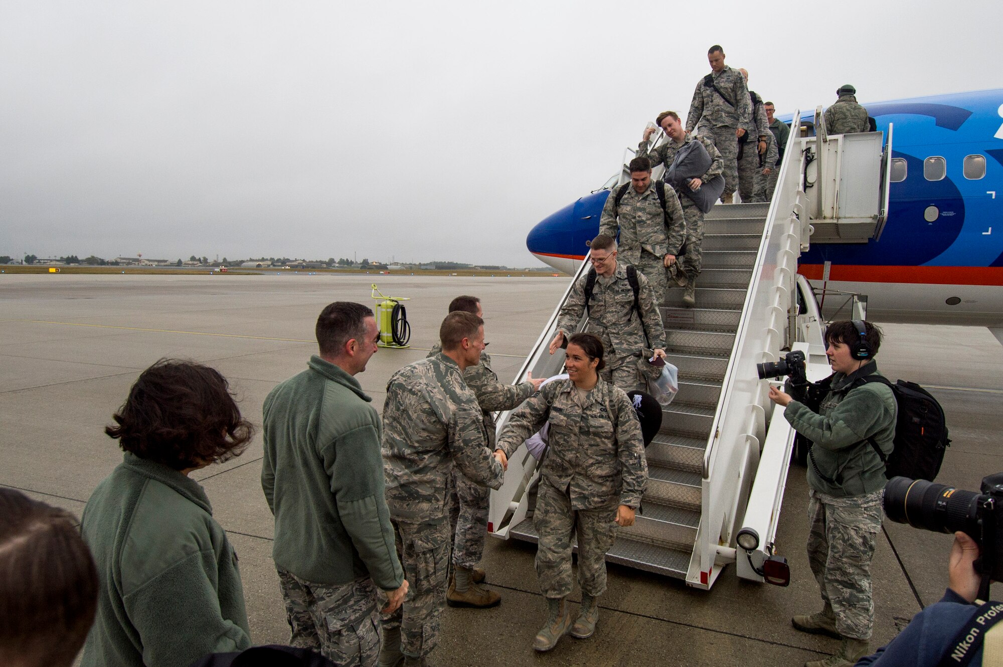 Airmen assigned to the 606th Air Control Squadron disembark a commercial aircraft on the flightline at Spangdahlem Air Base, Germany, Oct. 20, 2016. Nearly 200 Airmen assigned to the 606th ACS returned, from a six-month rotational deployment to Southwest Asia in support of Operations Freedom’s Sentinel and Inherent Resolve. (U.S. Air Force photo by Staff Sgt. Joe W. McFadden)