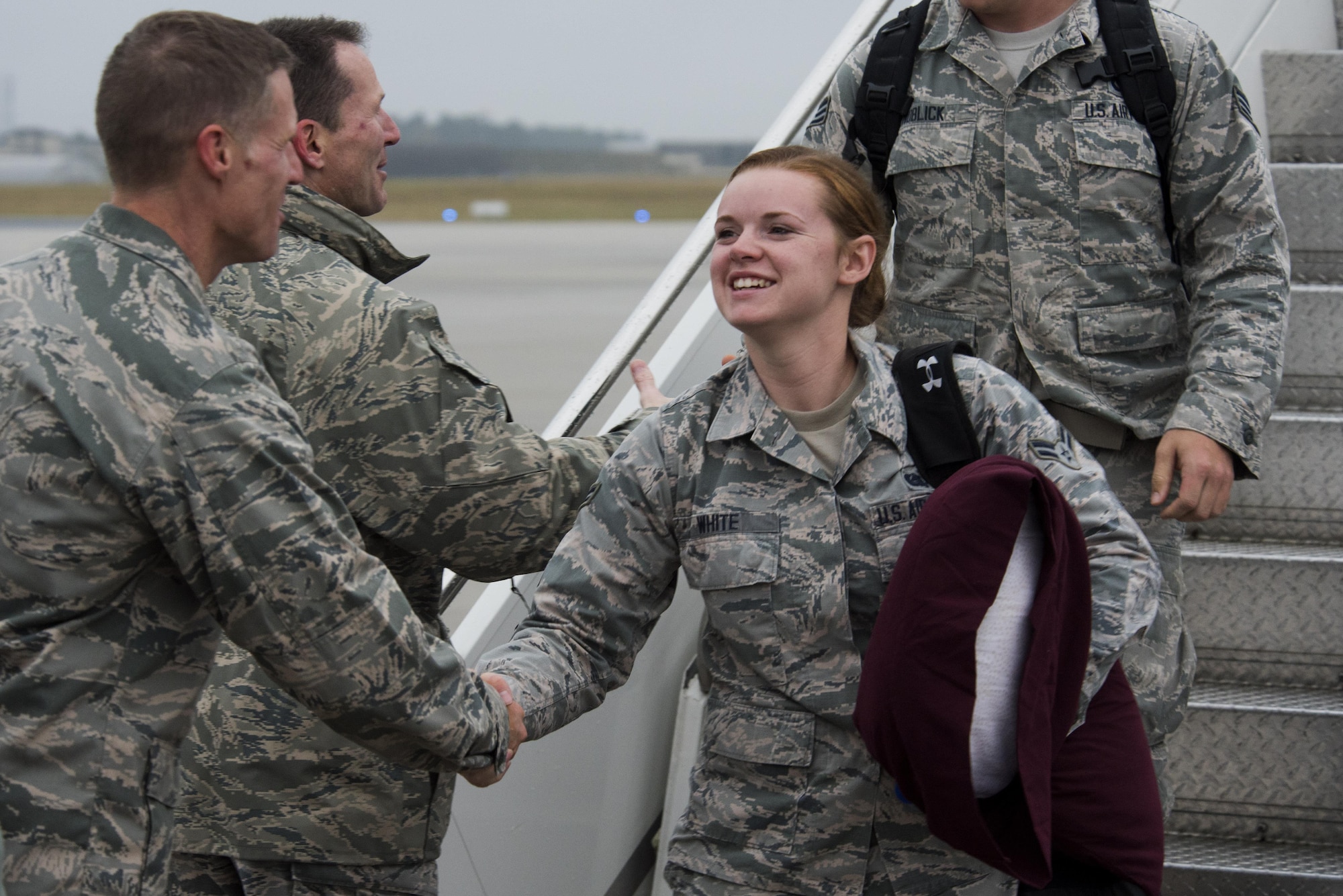Col. Michael Thompson, 52nd Operations Group commander, left, greets an Airman assigned to the 606th Air Control Squadron upon her return from deployment to their squadron at Spangdahlem Air Base, Germany, Oct. 20, 2016. Nearly 200 Airmen assigned to the 606th ACS returned, from a six-month rotational deployment to Southwest Asia in support of Operations Freedom’s Sentinel and Inherent Resolve. (U.S. Air Force photo by Staff Sgt. Joe W. McFadden)