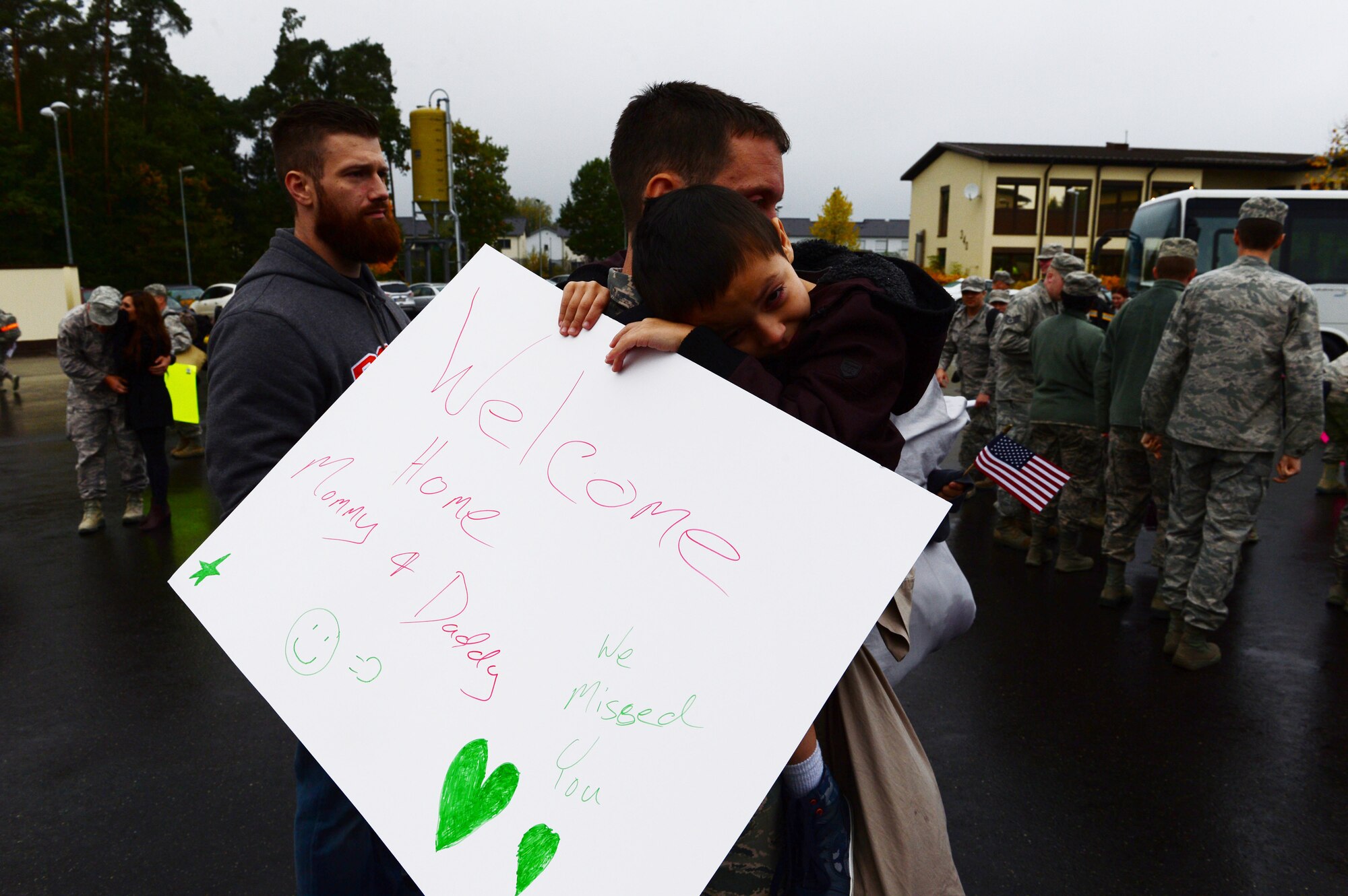 Ayoung boy hugs his father after waiting for his parents, assigned to the 606th Air Control Squadron, to return to Spangdahlem Air Base, Germany, Oct. 20, 2016, from a six-month rotational deployment to Southwest Asia in support of Operations Freedom’s Sentinel and Inherent Resolve. The unit provides daily command and control to the 480th Fighter Squadron, in addition to the occasional control of E-3A Sentry AWACS from NATO Air Base Geilenkirchen, Germany, and visiting aircraft from around the U.S. Air Forces in Europe's scope of operations. (U.S. Air Force photo by Senior Airman Joshua R. M. Dewberry)