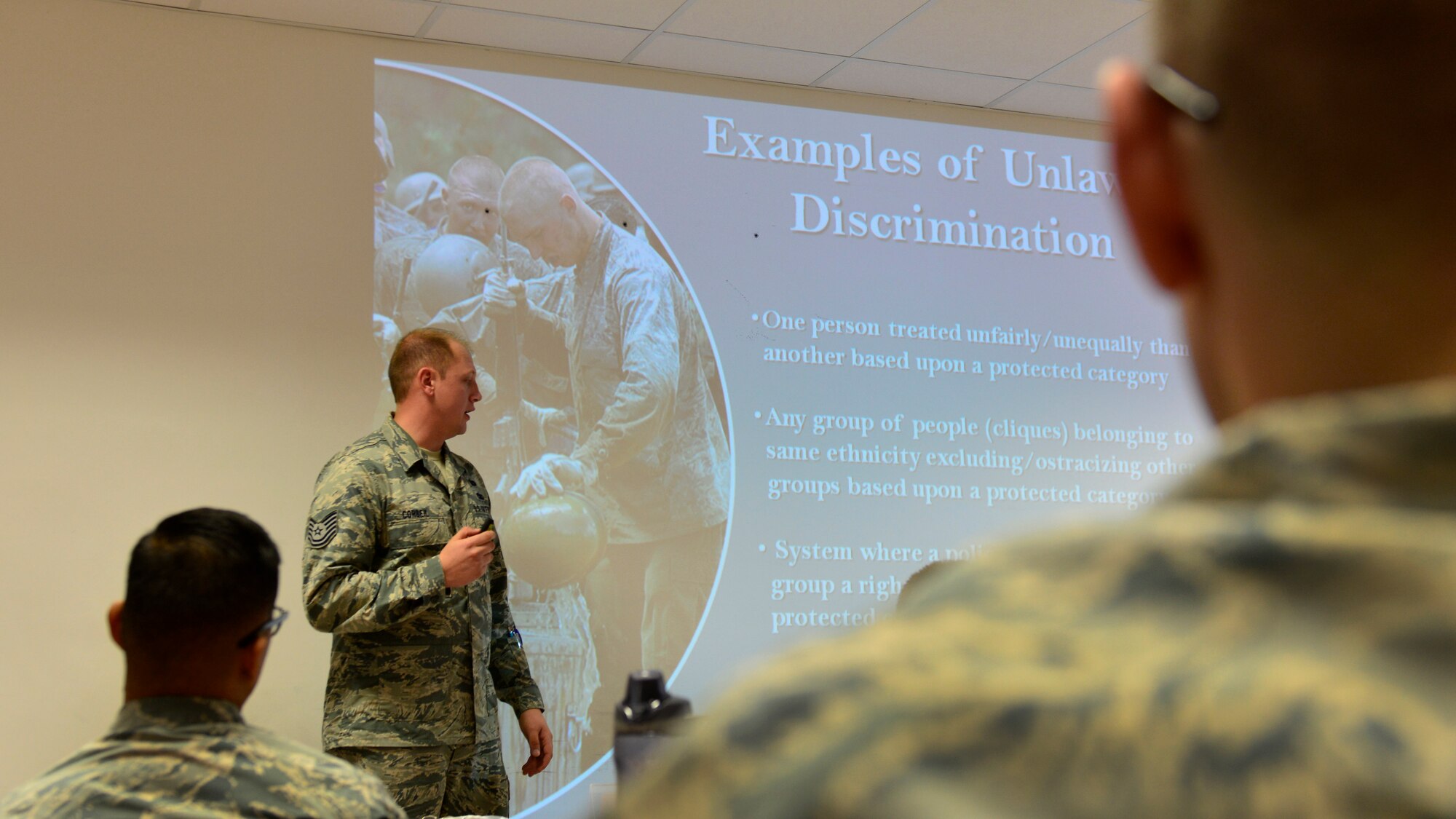 Tech. Sgt. Patrick Corbeil, 31st Fighter Wing equal opportunity NCO in-charge, briefs new Team Aviano Airmen on how to prevent workplace discrimination on Oct. 18, 2016 at Aviano Air Base, Italy. EO members educate Team Aviano personnel on appropriate workplace behavior. (U.S. Air Force photo by Senior Airman Cary Smith/Released)