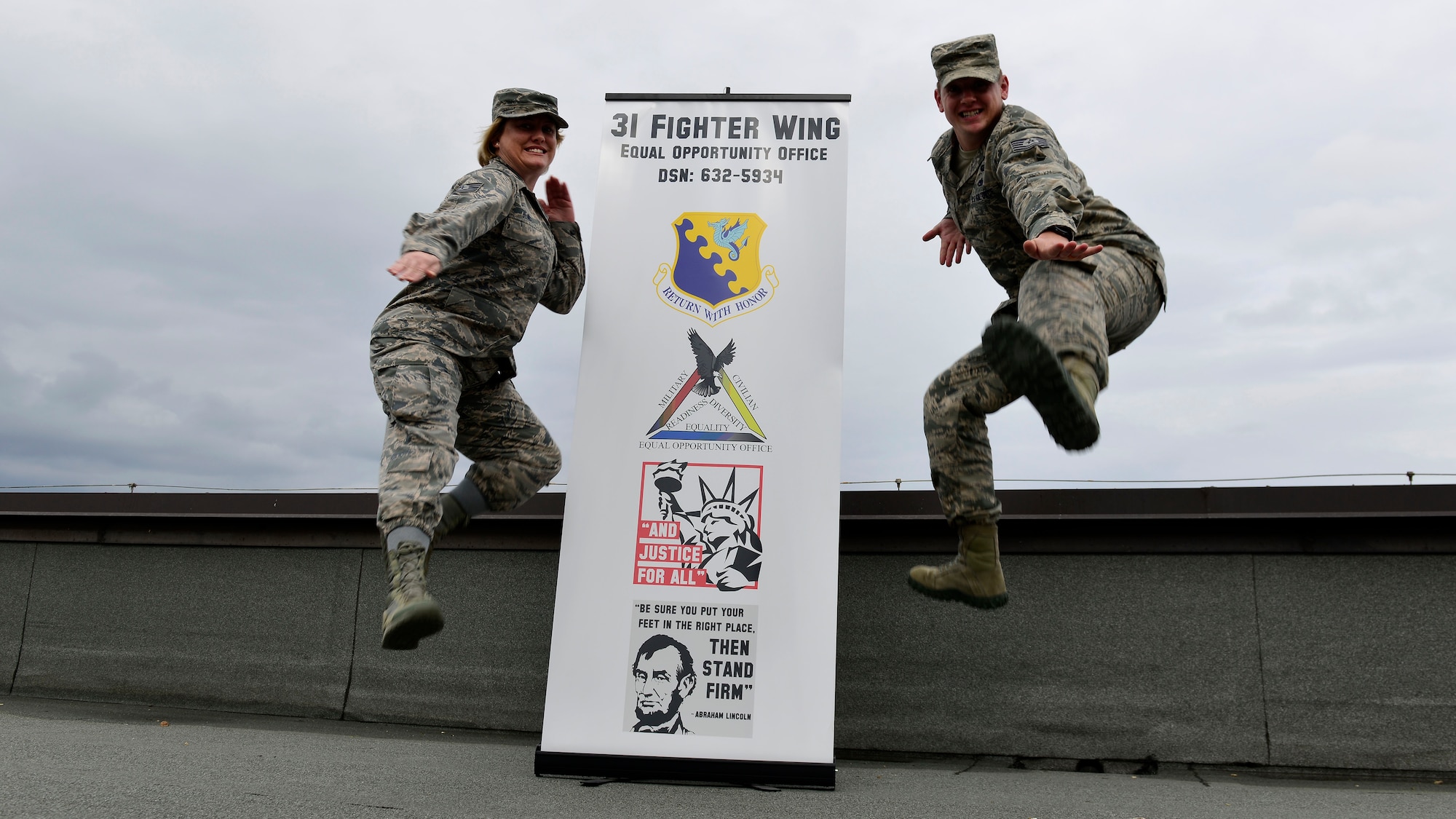 Tech. Sgts. Jessica Blace, 31st Fighter Wing equal opportunity director, and Patrick Corbeil, 31st FW EO NCO in-charge, Karate kick workplace discrimination at Aviano Air Base, Italy on Oct. 19, 2016. EO members handle discrimination complaints, develop human relations, perform climate surveys and educate DOD employees on legally protected categories. (U.S. Air Force photo by Senior Airman Cary Smith/Released)