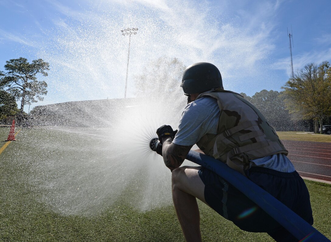 Air commandos participate in the Fire Prevention Week fire muster challenge at Hurlburt Field, Fla., Oct. 14, 2016. This year’s theme of “Don’t wait -- check the date!” informs Airmen to check the dates on fire detectors because they have a life span of 10 years and must be replaced regularly. (U.S. Air Force photo/Senior Airman Andrea Posey)