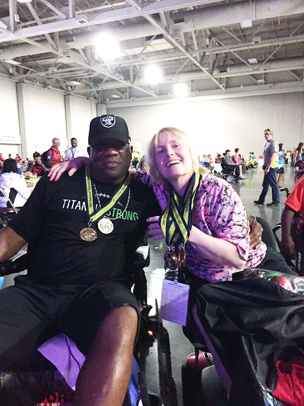 Kathy Tilbury poses with Duke Roscoe, a retired Marine from Atlanta, Georgia. Both received gold medals after competing in handle ball bowling during the National Veterans’ Wheelchair Games June 26 – July 2, 2016 in Salt Lake City, Utah. Tilbury is a retired Navy Petty Officer 2nd Class, and currently works as a program management analyst for Defense Logistics Agency’s Office of Operations Resource and Research Analysis on Defense Supply Center Richmond, Virginia.