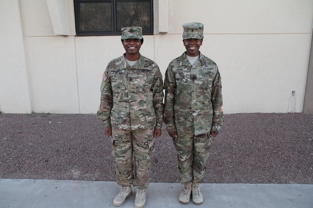 Colonel Paul Hettich, the rear commander of the 451st Expeditionary Sustainment Command, visited the 387th Human Resources detachment and recognized 1st Lieutenant LaShontonna Sipho, platoon leader of the detachment, and Sergeant First Class Telia Phoenix, platoon sergeant of the detachment, for their hard work. “You both have done a great job preparing Soldiers and I know this will be a successful deployment,” said Col. Hettich as he coined both women. This is the first deployment for Sipho and Phoenix who, combined, are the command team for the small postal detachment.