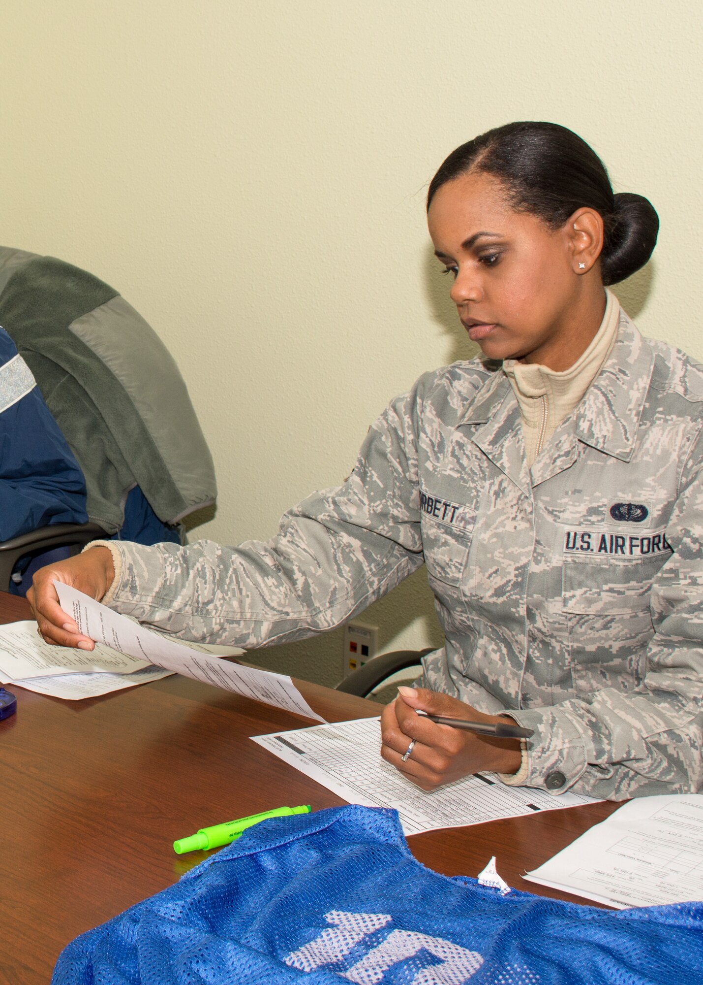 Senior Airman Siera Corbett, 349th Force Support Squadron, reviews fitness assessment documents during the Oct. 1 unit training assembly. (U.S. Air Force photo by Senior Master Sgt. Rachel Martinez)