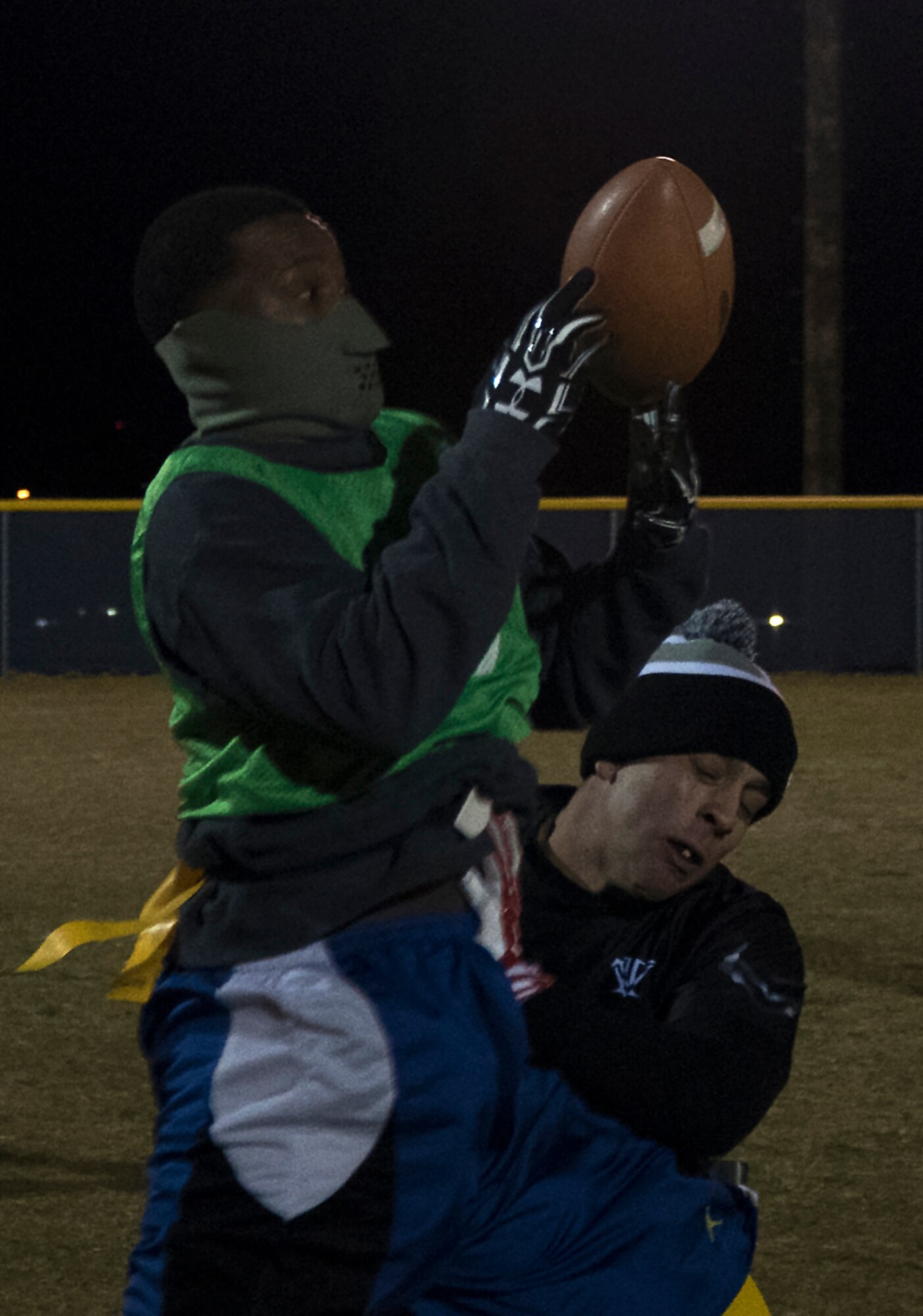 Everette Gaines, 90th Maintenance Group and 20th Air Force intramural flag football team member, catches a pass during the championship game at F.E. Warren Air Force Base, Wyo., Oct. 19, 2016. Teams played with 8 members on the field at a time, resulting in several one-on-one match ups. (U.S. Air Force photo by Senior Airman Brandon Valle)