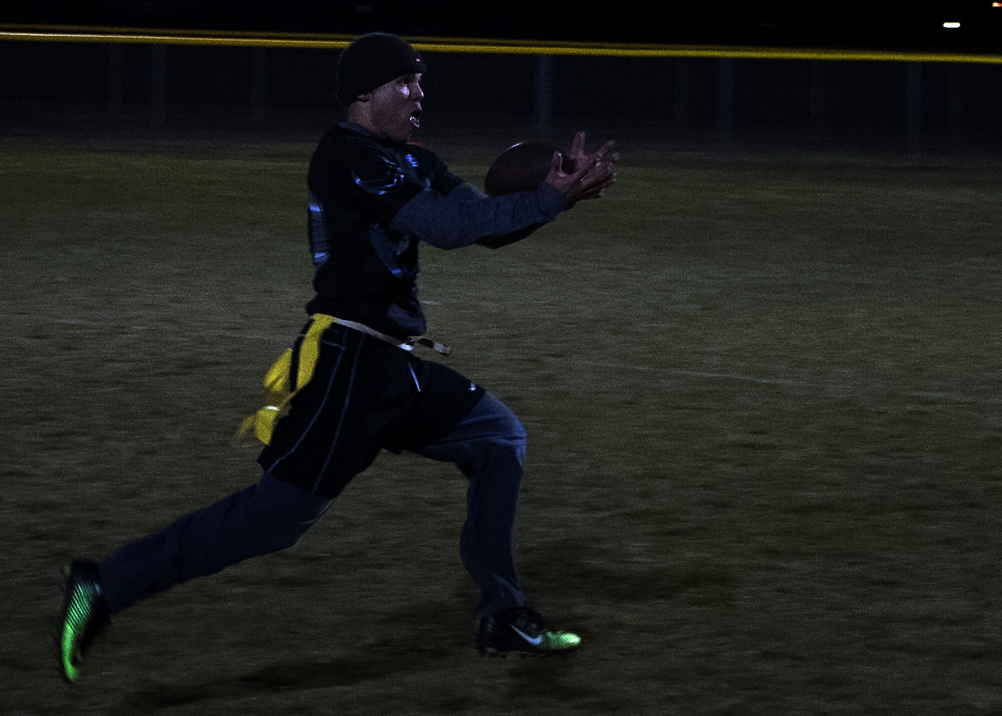 Tyler Kim, 790th Missile Security Forces Squadron Tactical Response Force intramural flag football team member, catches a pass during the championship game on F.E. Warren Air Force Base, Wyo., Oct. 19, 2016. The TRF team won two games before losing in the final match 14-6. (U.S. Air Force photo by Senior Airman Brandon Valle)