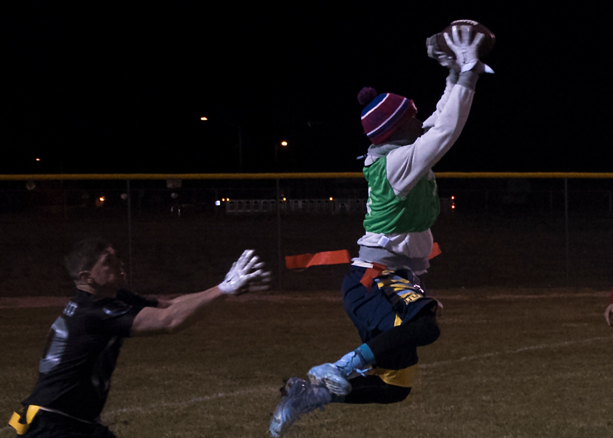 Christopher Marshall, 90th Maintenance group and 20th Air Force intramural flag football team member, catches a pass during the championship game at F.E. Warren Air Force Base, Wyo., Oct. 19, 2016. The playoffs were a double elimination tournament, forcing a second championship game between the two teams. (U.S. Air Force photo by Senior Airman Brandon Valle)