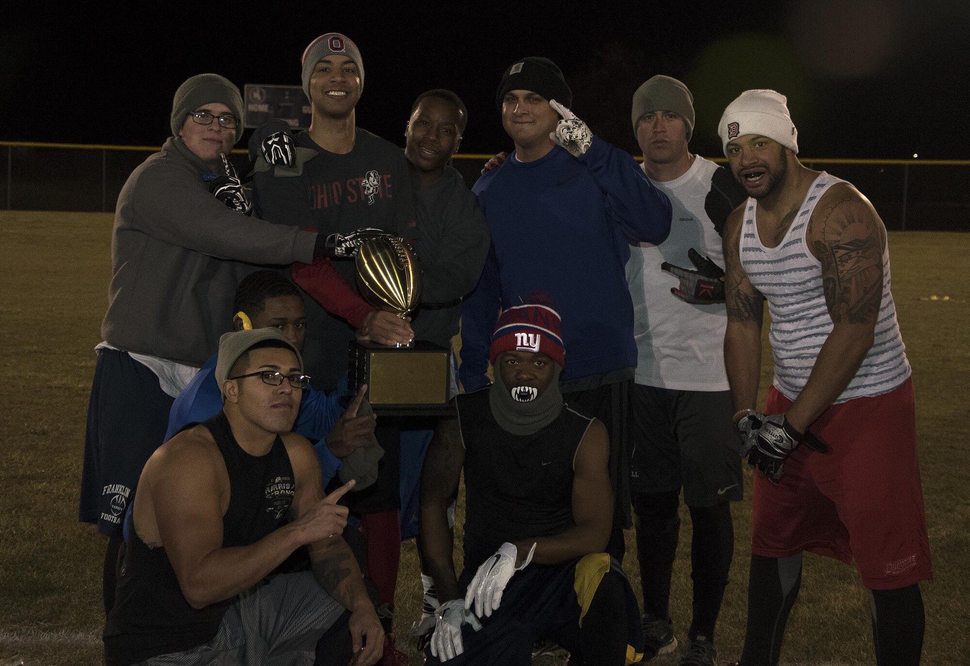 The 90th Maintenance Group and 20th Air Force intramural flag football team pose after winning the championship at F.E. Warren Air Force Base, Wyo., Oct. 19, 2016. The team will keep the trophy until the conclusion of the intramural basketball championship in January. (U.S. Air Force photo by Senior Airman Brandon Valle)