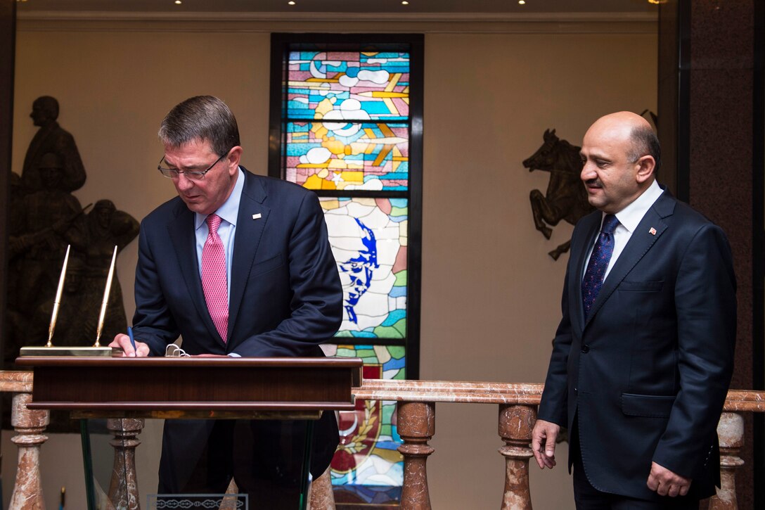 Defense Secretary Ash Carter signs the guest book before meeting with Turkish Defense Minister Fikri Işık in Ankara, Turkey, Oct. 21, 2016. DoD photo by U.S. Air Force Tech. Sgt. Brigitte N. Brantley