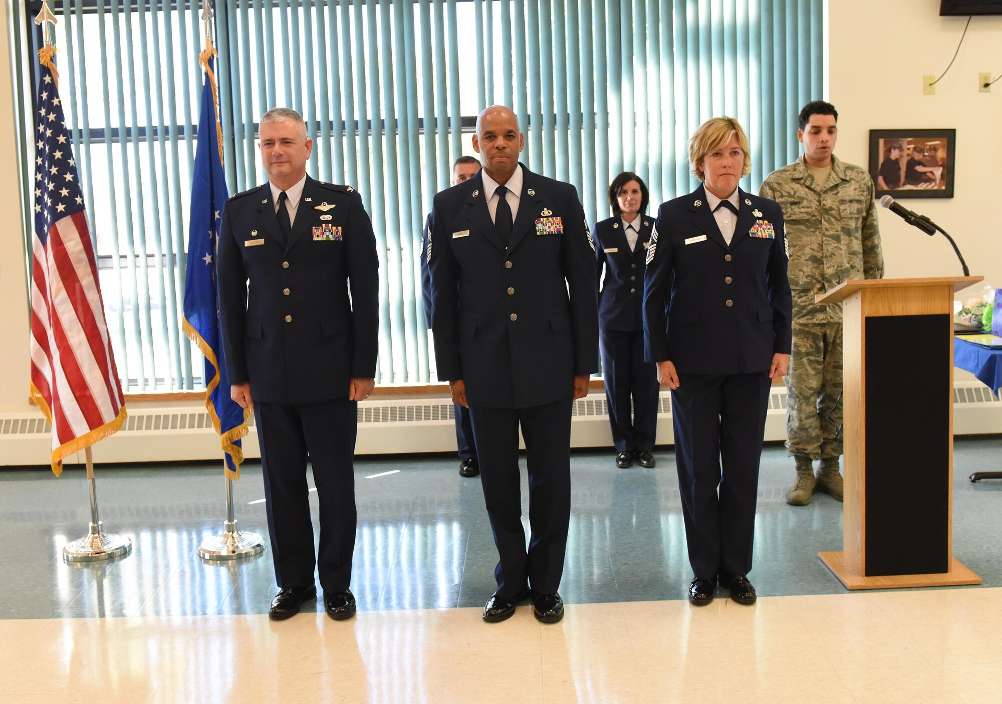 Chief Master Sgt. Denny Richardson (center) assumes the duties of 109th Airlift Wing command chief during a change of authority ceremony at Stratton Air National Guard Base, N.Y., on Oct. 6, 2016. Also pictured are Col. Shawn Clouthier (left), 109th AW commander, and outgoing 109th AW command chief, Chief Master Sgt. Amy Giaquinto. Giaquinto is now the New York Air National Guard command chief. (U.S. Air National Guard photo by Master Sgt. William Gizara/Released)