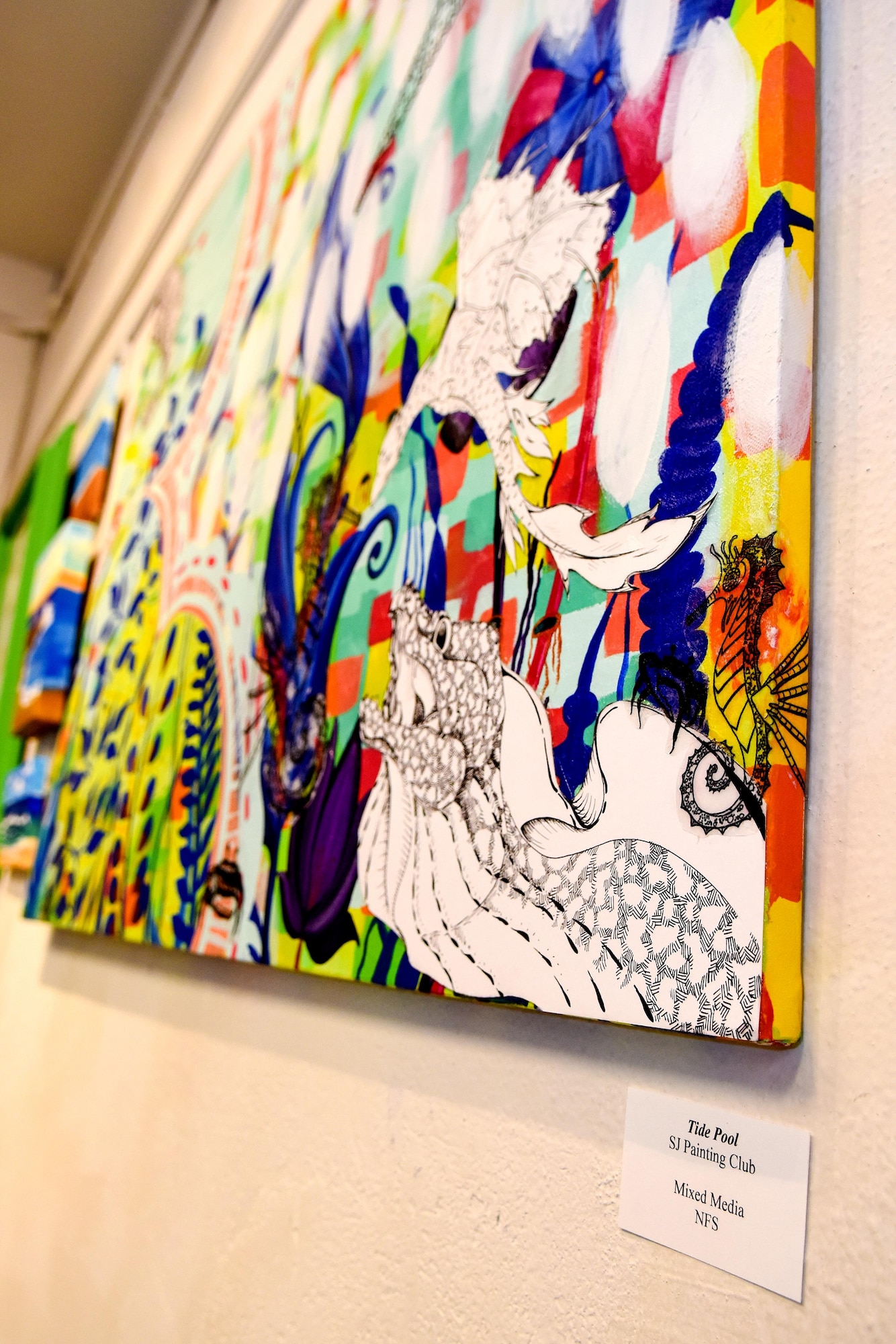 A collaborative art piece titled “Tide Pool” hangs in the T.A. Loving Gallery at the Arts Council of Wayne County, Sept. 8, 2016, in Goldsboro, North Carolina. Members of the Seymour Johnson Painting Club worked together on the mixed media piece that hung in the gallery through the month of September. (U.S. Air Force photo by Airman Shawna L. Keyes)