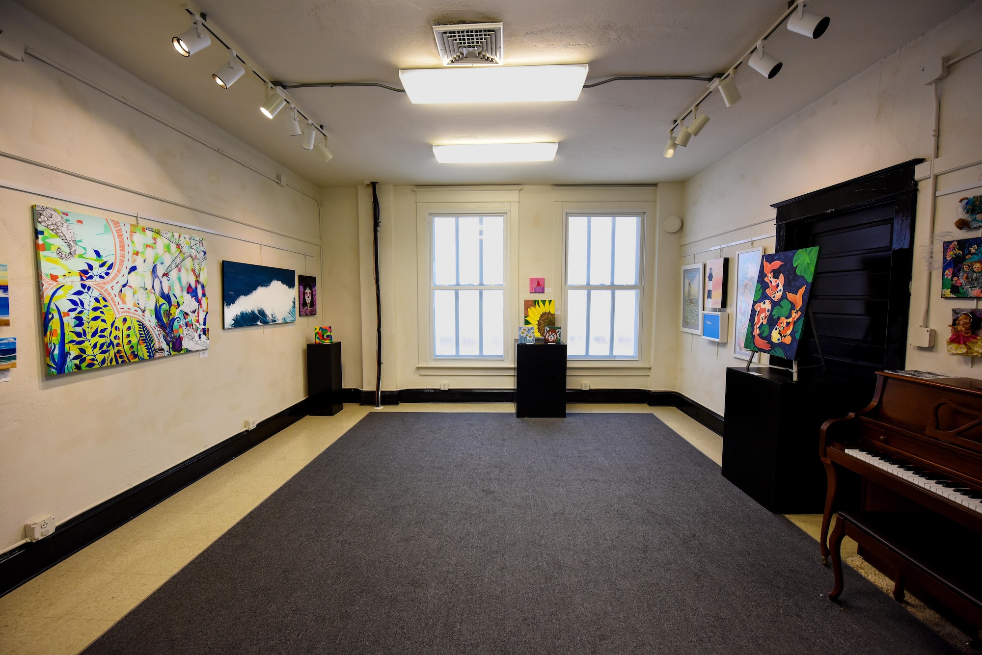 More than 20 art pieces hang in the T.A. Loving Gallery at the Arts Council of Wayne County, Sept. 8, 2016, in Goldsboro, North Carolina. Members of the Seymour Johnson Painting Club contributed various styles of artwork to the exhibit. (U.S. Air Force photo by Airman Shawna L. Keyes)