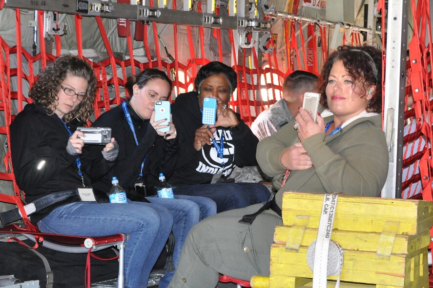 Participants record a moment on the cargo deck of a C-130H Hercules tactical cargo aircraft while it sits on the flightline here prior to takeoff during the 910th Airlift Wing’s Civic Leader Flight for Educators, Oct. 19, 2016. The purpose of the event was to allow attendees to learn more about Air Force Reserve career opportunities from their local recruiting team and have a fuller understanding of the 910th’s mission and a greater appreciation for Air Force Reserve opportunities available to students in Northeast Ohio. (U.S. Air Force photo/Master Sgt. Bob Barko Jr.)