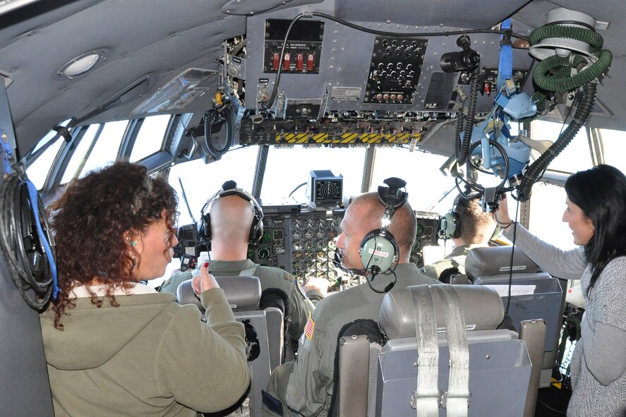 Senior Master Sgt. Paul Miller, a flight engineer assigned to the 757th Airlift Squadron, talks with participants of the 910th Airlift Wing’s Civic Leader Flight for Educators on the flight deck of a C-130H Hercules tactical cargo aircraft as the plane heads toward an orbit pattern above Niagara Falls, Oct. 19, 2016. The purpose of the event was to allow attendees to learn more about Air Force Reserve career opportunities from their local recruiting team and have a fuller understanding of the 910th’s mission and a greater appreciation for Air Force Reserve opportunities available to students in Northeast Ohio. (U.S. Air Force photo/Master Sgt. Bob Barko Jr.) 