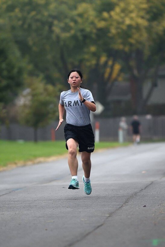 Army Reserve 2nd Lt. Jiaru Bryar runs the last stretch of a two-mile run during the Army Physical Fitness Test, October 15, 2016. The Army Physical Fitness Test (APFT) is designed to test the muscular strength, endurance, and cardiovascular respiratory fitness of soldiers in the Army. Soldiers are scored based on their performance in three events consisting of the push-up, sit-up, and a two-mile run, ranging from 0 to 100 points in each event.
(Photo by Master Sgt. Anthony L. Taylor)