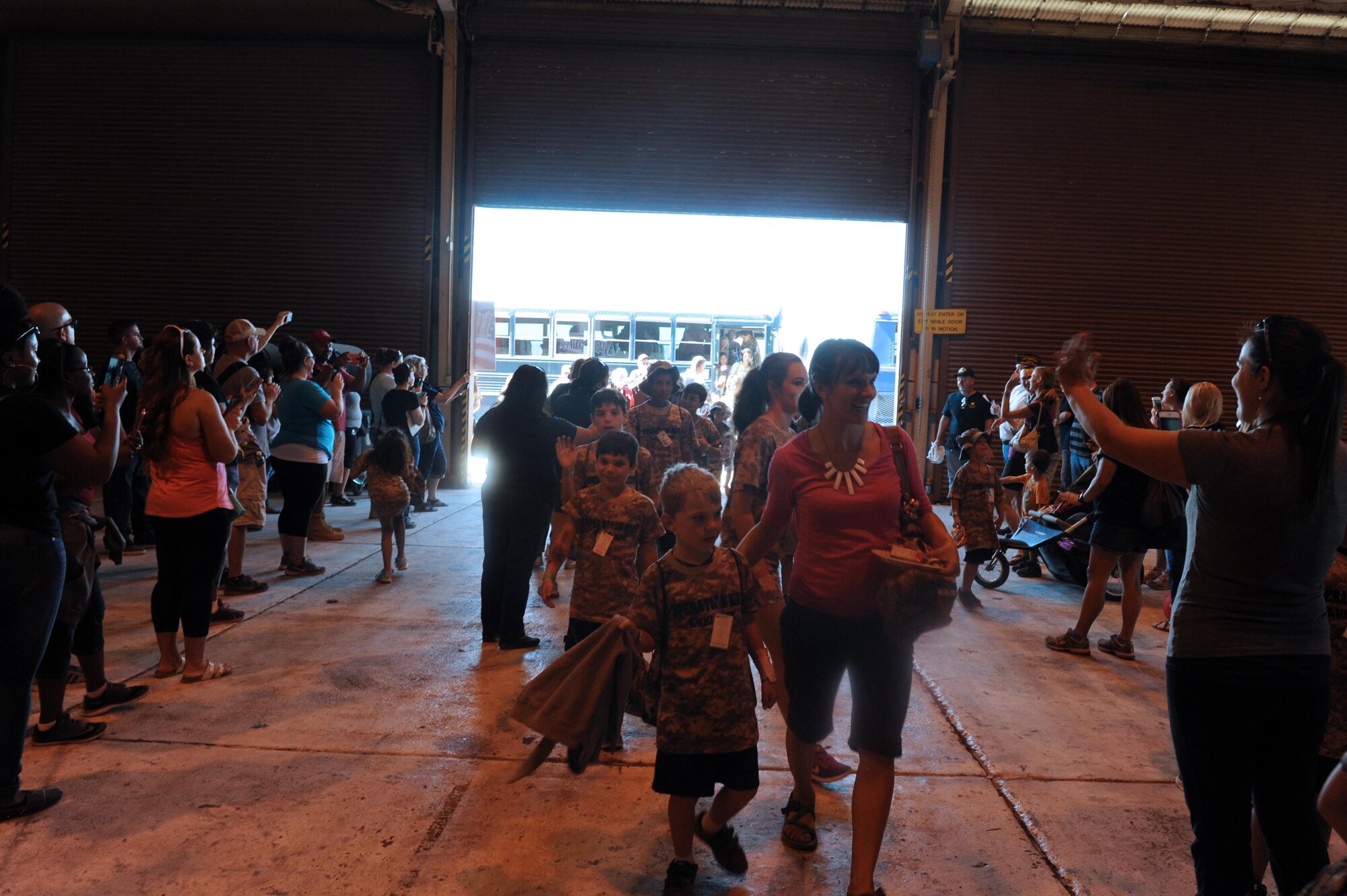 Operation Kids participants receive a hero’s welcome home upon returning from a simulated deployment Oct. 15 at Luke Air Force Base, Ariz. More than 120 children attended the event. (U.S. Air Force Photos by Airman 1st Class Pedro Mota)