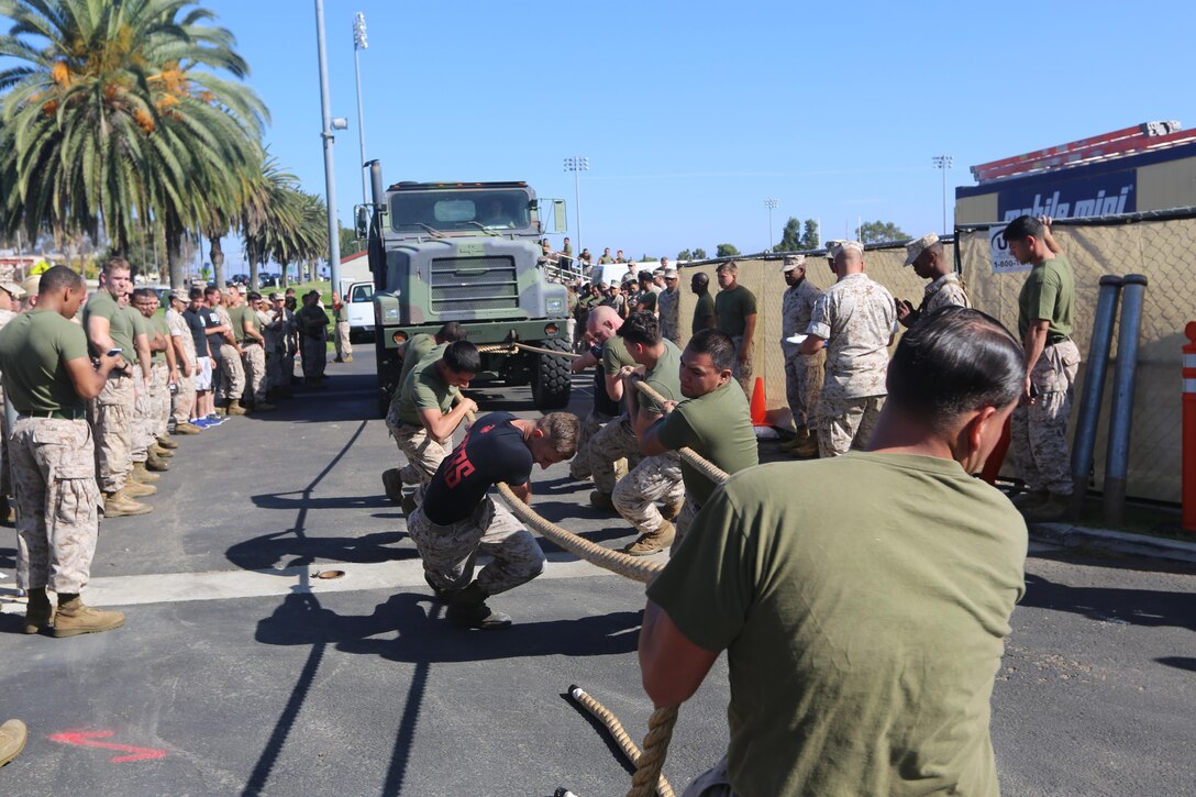 Marines with Marine Aircraft Group (MAG) 39 compete in a truck pull during the Warrior Games Field Meet at Marine Corps Base Camp Pendleton, Calif., Oct. 15. The Warrior Games consisted of a five-month competition between squadrons within MAG-39, culminating in a field meet, where each squadron competed to win points toward a trophy and grand prize of a 72-hour liberty period.(U.S. Marine Corps photo by Lance Cpl. Jacob Pruitt/Released)