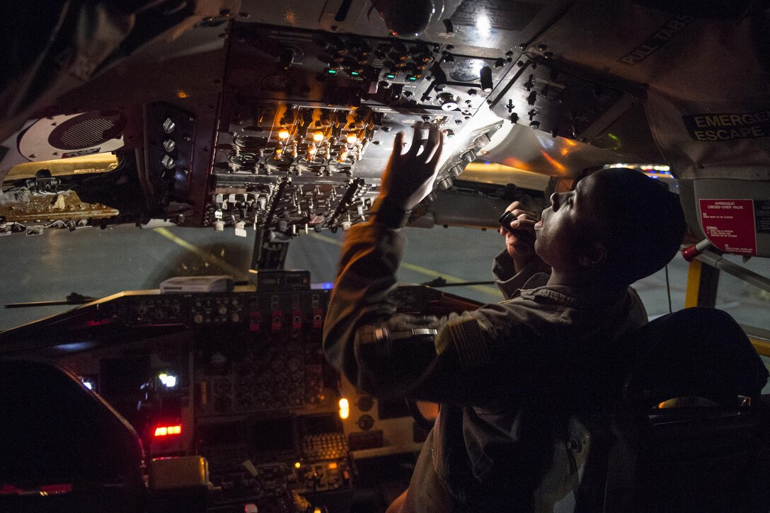 Air Force Capt. Jaamal Neal performs preflight checks at Joint Base Elmendorf-Richardson, Alaska, Oct. 20, 2016, before taking off to provide refueling capabilities to Canadian CF-18s during Vigilant Shield 2017, a  training exercise in the high Arctic. Neal is a KC-135 Stratotanker co-pilot assigned to the 912th Air Refueling Squadron, March Air Force Base, Calif. Air Force photo by Tech. Sgt. Gregory Brook