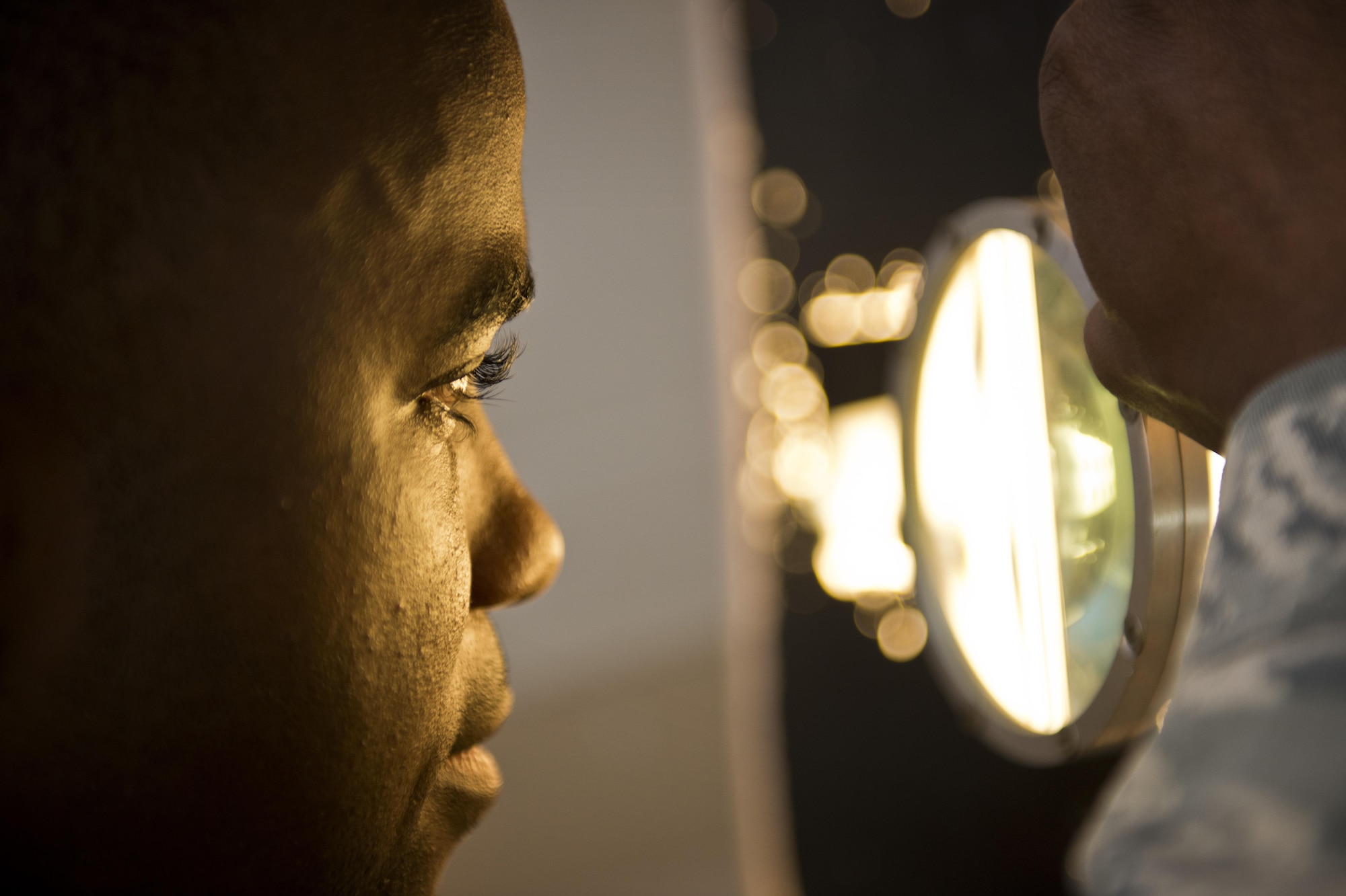 Staff Sgt. Darrell Cross-Williams, 5th Maintenance Squadron assistant NCO in charge of non-destructive inspection, examines x-ray film at Minot Air Force Base, N.D., Oct. 17, 2016. Non-destructive inspection Airmen from the 5th MXS utilize x-rays for inspecting welds on the B-52H Stratofortress. (U.S. Air Force photo/Airman 1st Class J.T. Armstrong)