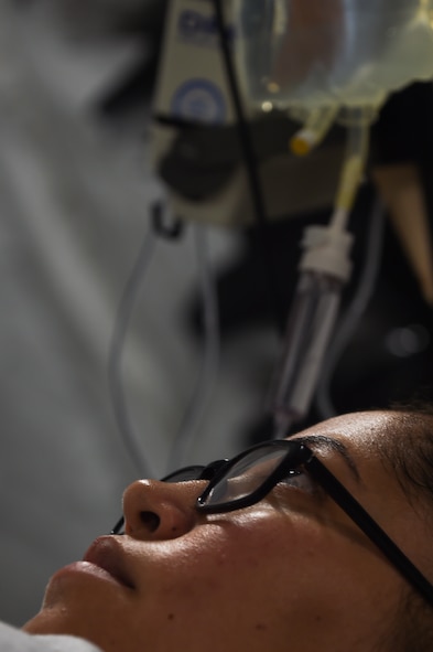U.S. Air Force Senior Airman Jenny Manueles, 633rd Surgical Operations Squadron surgical technician, receives treatment in the critical care unit during a medical global response force training exercise at Joint Base Langley-Eustis, Va., Oct. 20, 2016. The training demonstrated basic medical care needs and critical care needs that could occur in a humanitarian aid environment. (U.S. Air Force photo by Staff Sgt. Natasha Stannard)
