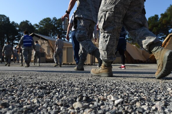Members of the 633rd Medical Group start the simulated portion of their global response force training exercise at Joint Base Langley-Eustis, Va., Oct. 20, 2016. The training included setting up the 25-bed field hospital, treating real-word active duty patients and treating simulated conditions frequently seen in a humanitarian crisis. (U.S. Air Force photo by Staff Sgt. Natasha Stannard)