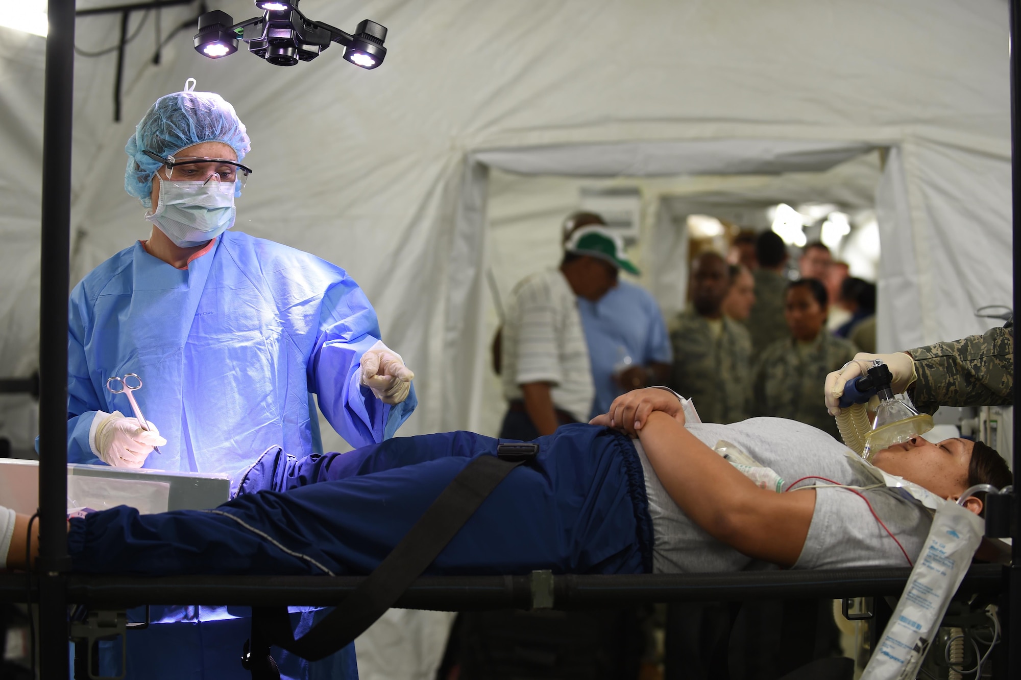 U.S. Air Force Emergency room doctors and technicians treat patients with simulated injuries and illnesses during a medical global response force training exercise at Joint Base Langley-Eustis, Va., Oct. 20, 2016. Members of the medical group put the 25-bed field hospital to the test while treating real-world and simulated patients. (U.S. Air Force photo by Staff Sgt. Natasha Stannard)