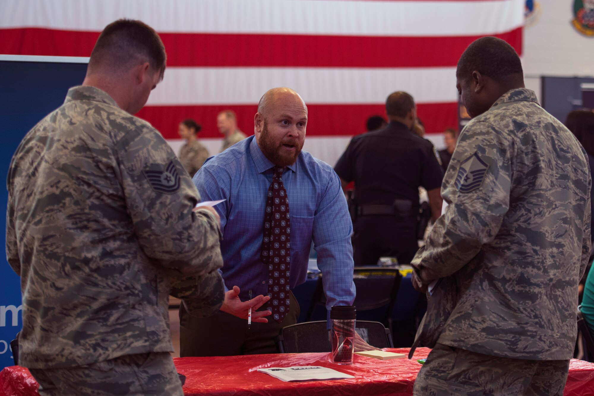 Brian Ballard, a local truck service general manager, talks to Airmen about employment opportunities during a job fair, Oct. 20, 2016, at Moody Air Force Base, Ga. Ballard, a former Marine, talked about veterans’ advantages in the competitive job market. (U.S. Air Force photo by Airman 1st Class Greg Nash)