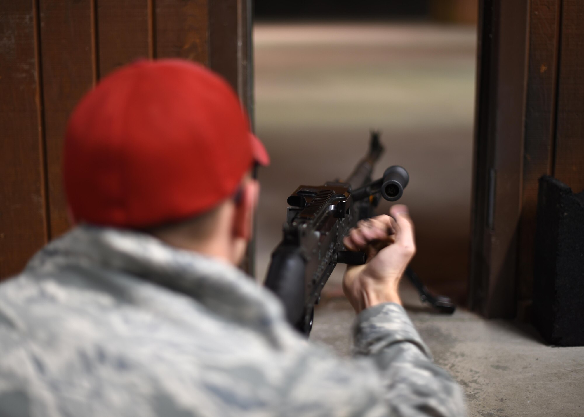 Staff Sgt. Frank Witmer, 319th Security Forces Squadron combat arms instructor, charges an M-4 carbine rifle Oct. 21, 2016, on Grand Forks Air Force Base, N.D. Witmer fired the test rounds for the safety inspection of the newly-renovated firing range. (U.S. Air Force photo by Senior Airman Ryan Sparks)