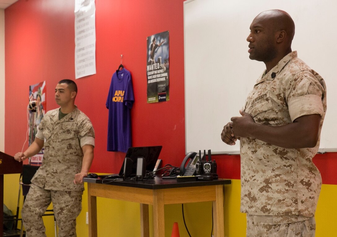 Master Sgt. Jeffrey Gibson (right), distribution management chief, Marine Forces Reserve, speaks to cadets at New Orleans Military and Maritime Academy during Red Ribbon Week, Oct. 20, 2016. Every year in October the Marines educate cadets on the dangers of alcohol and drug abuse, and give them guidance to make good choices for their future. (U.S. Marine Corps photo by Lance Cpl. Dallas Johnson/Released)